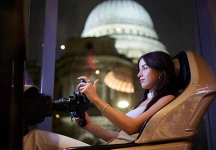 Lady racing in an F1 Sim